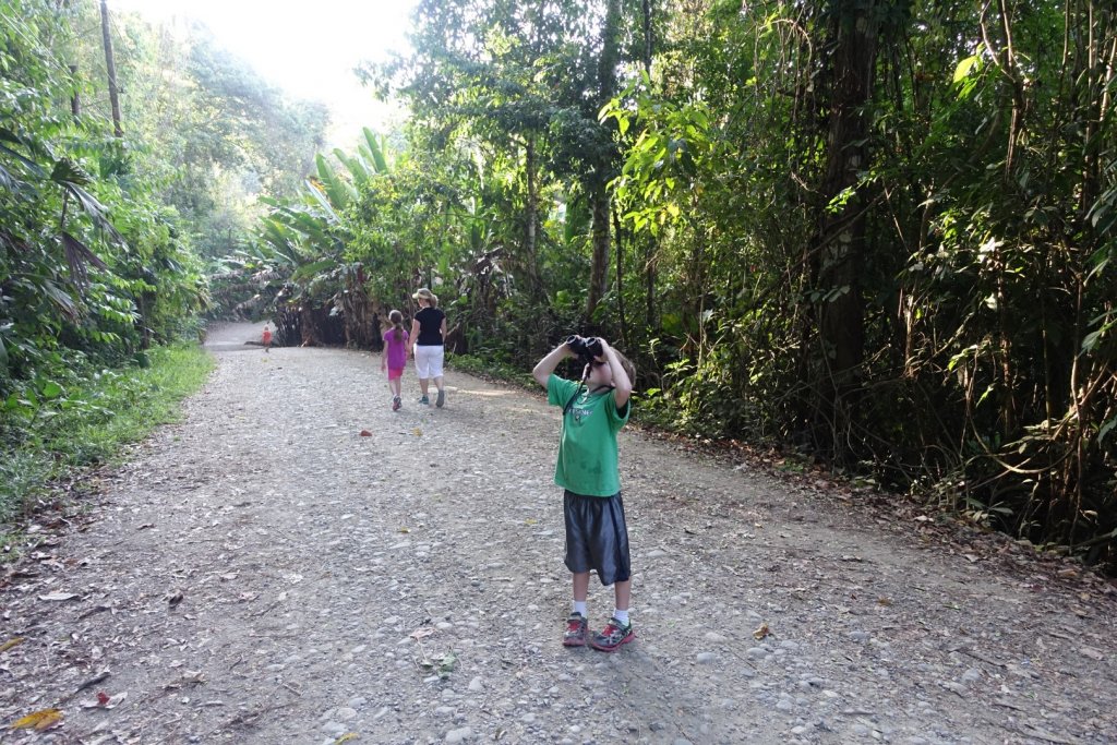 boy looking through binoculars